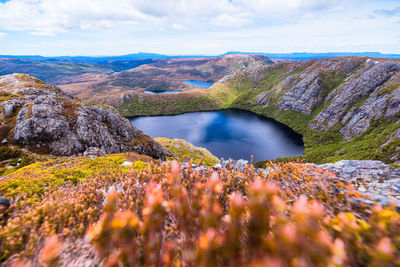 Scenic view of lake and mountains against sky