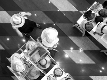 High angle view of people buying hat in store