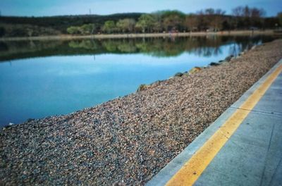 Surface level of road by lake