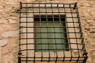 Low angle view of window on wall