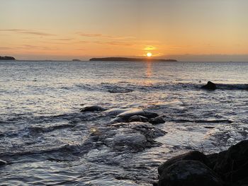 Scenic view of sea against sky during sunset