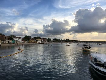 Scenic view of river against sky at sunset