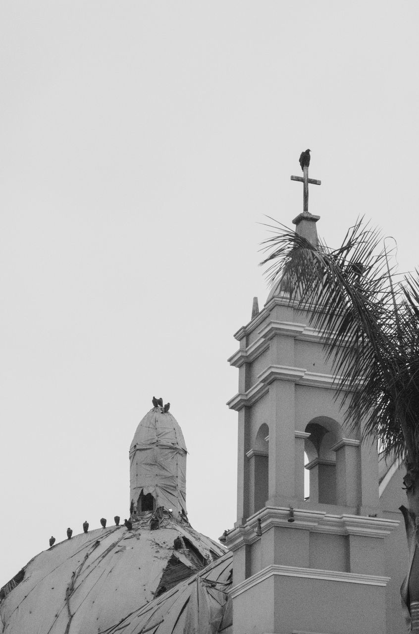 LOW ANGLE VIEW OF CATHEDRAL AGAINST BUILDING AGAINST CLEAR SKY