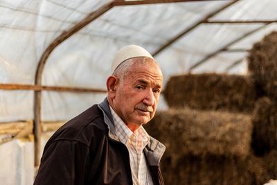 Portrait of man in greenhouse