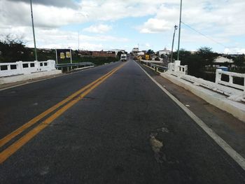 Surface level of road against sky in city