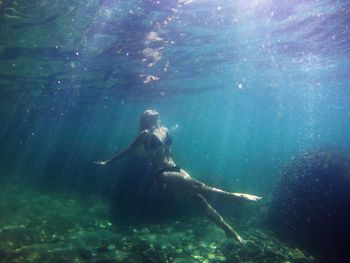 Woman swimming in sea