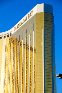 Low angle view of built structure against blue sky