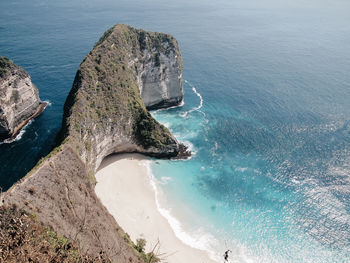 High angle view of rocks on sea shore