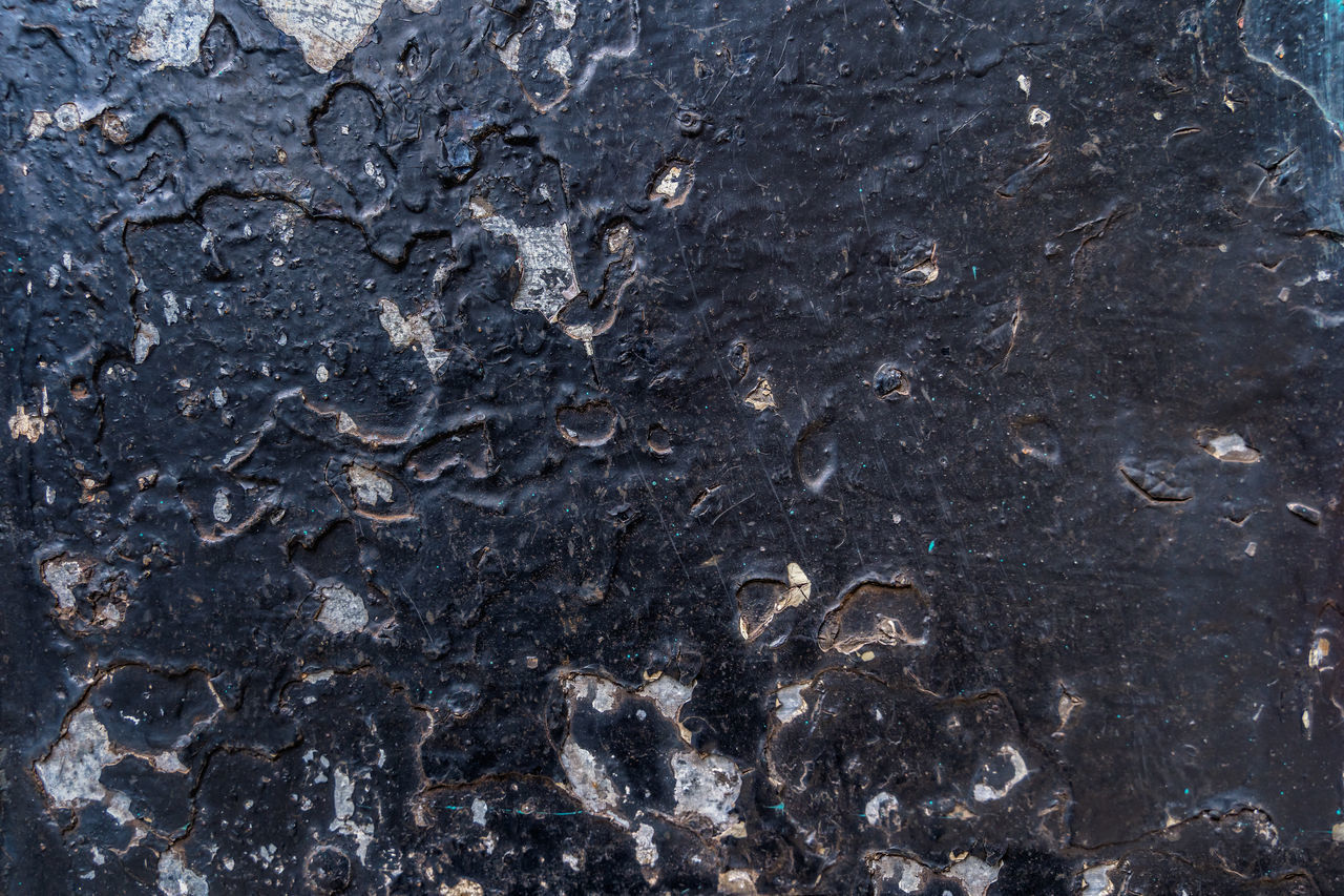 FULL FRAME SHOT OF ROCKS ON GROUND