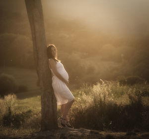 Backlit pregnant girl 