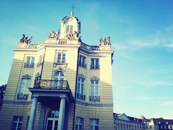 Low angle view of building against blue sky