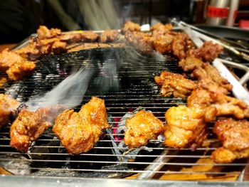 Close-up of meat on barbecue grill