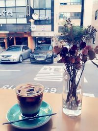 Close-up of coffee served on table at cafe
