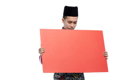Man standing on paper against white background
