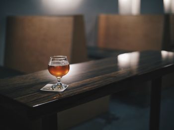 Close-up of drink in wineglass on table