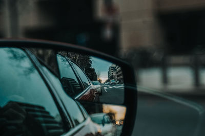 Reflection of car on side-view mirror