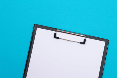 Low angle view of metallic structure against blue sky