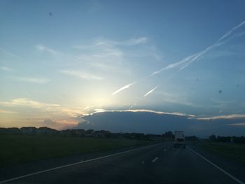 Scenic view of road against sky during sunset