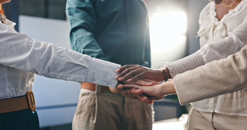 Midsection of businessmen shaking hands