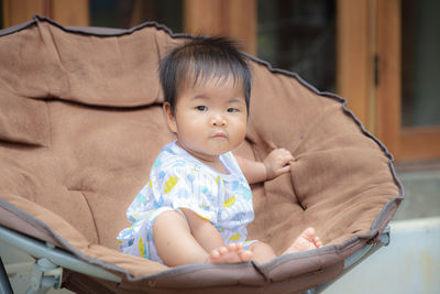 Portrait of cute baby girl at home