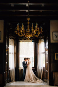 Couple standing in corridor of building