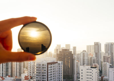 View of sunset through circular nd filter at whampoa dew public housing hdb in singapore