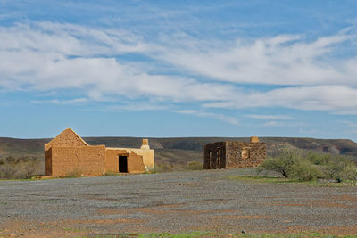 Castle on field against sky