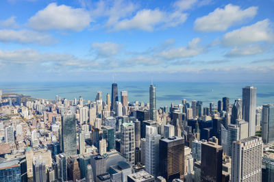 High angle view of cityscape against cloudy sky