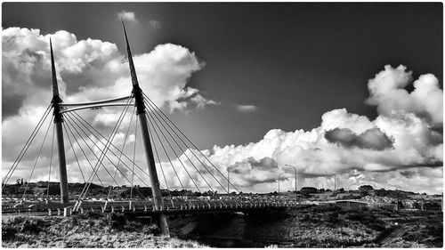 View of bridge against cloudy sky