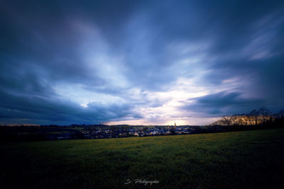 Houses on landscape against sky