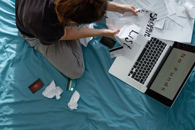 High angle view of woman using mobile phone