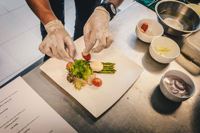 High angle view of person preparing food on table