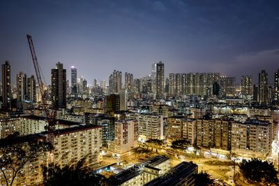 Aerial view of city lit up at night