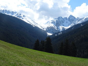 Scenic view of snowcapped mountains against sky