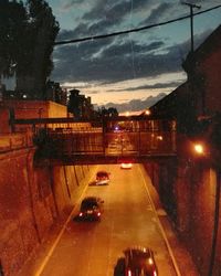 Cars on road in city at night