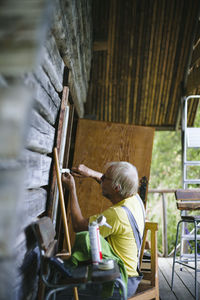 Man repairing house