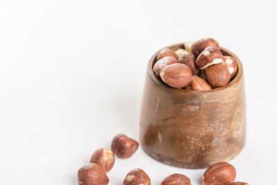 Close-up of coffee beans against white background