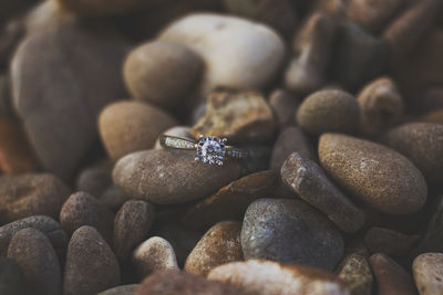 Close-up of ring on pebbles