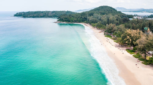 Aerial landscape view surin beach and small tourist on the sand beach at summer holiday phuket 