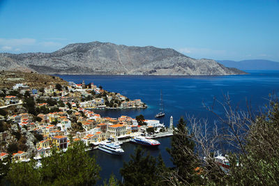 High angle view of sea and buildings against sky