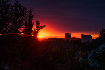 Cityscape against sky during sunset