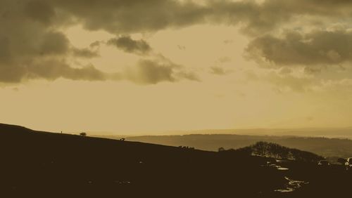 Scenic view of silhouette landscape against sky during sunset