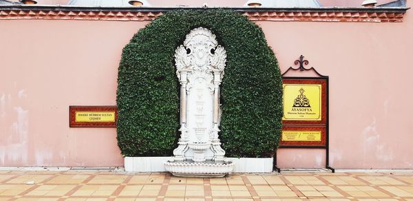 Statue against building