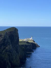 Scenic view of sea against clear blue sky