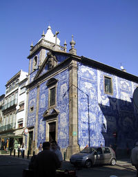 Low angle view of building against clear blue sky