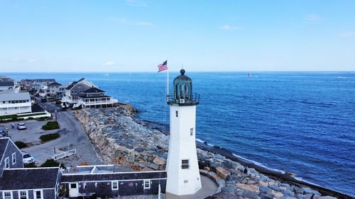 Scenic view of lighthouse and  sea against sky