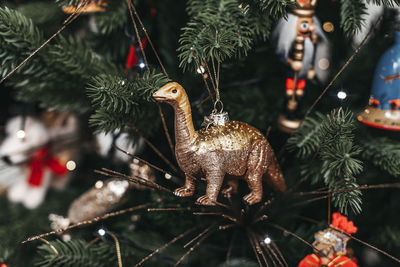 Close-up of christmas ornaments on tree