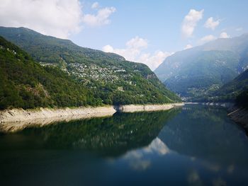 Scenic view of lake and mountains against sky