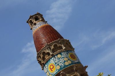 Low angle view of statue against blue sky