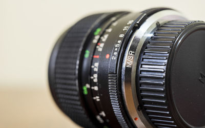 Close-up of camera lens on table